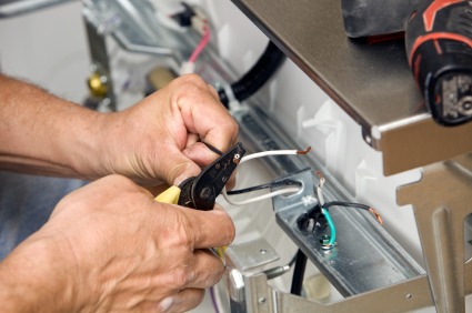 PTI Electric, Plumbing, & HVAC repairing electric wires.