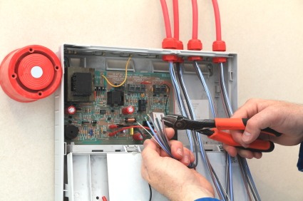 PTI Electric, Plumbing, & HVAC installing alarm system in Darbydale, OH